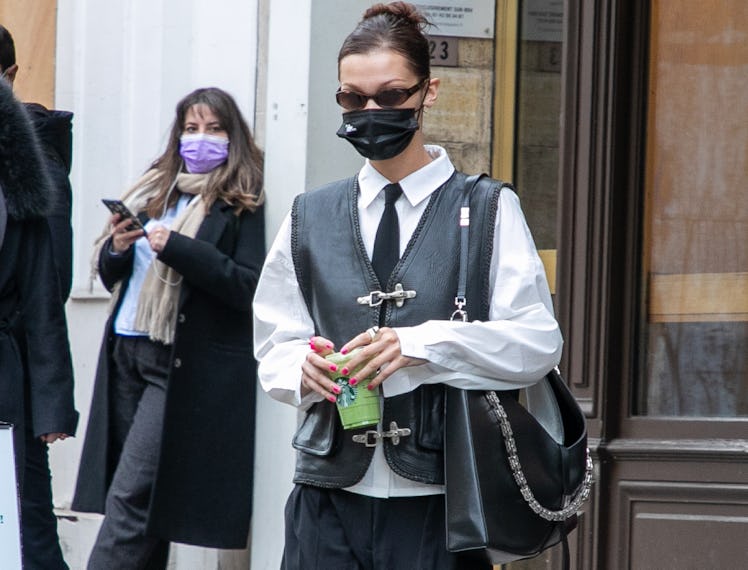 Bella Hadid walking down a street in her Diane Keaton-Inspired outfit