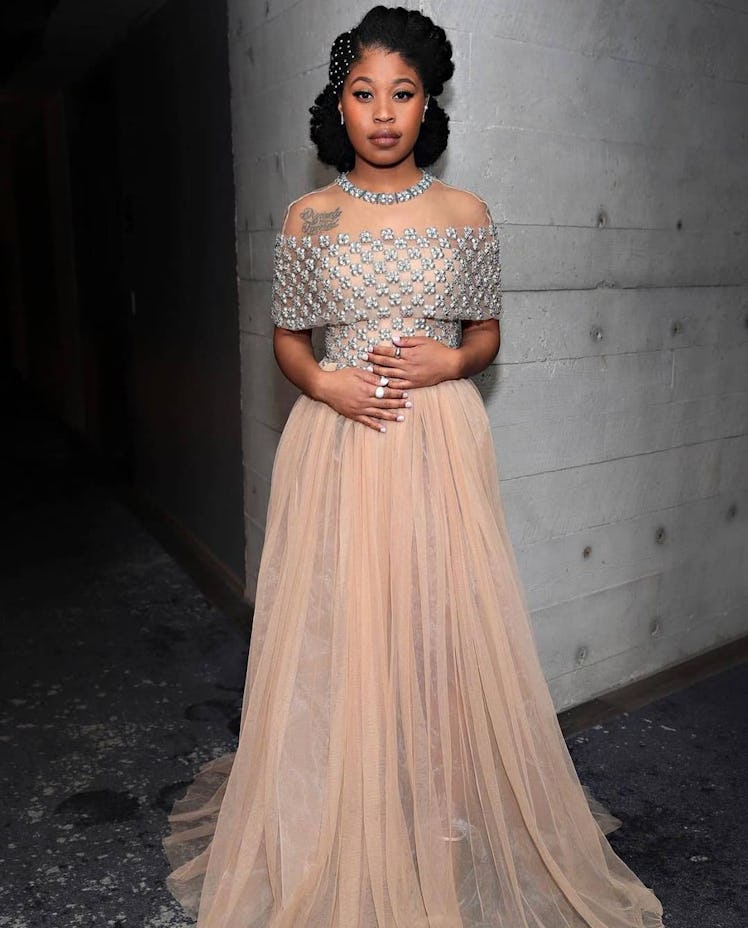 Dominique Fishback in a silver and pink Reem Acra gown