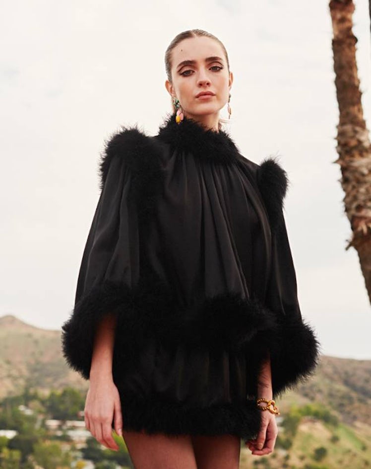 Talia Ryder posing in a black Saint Laurent dress