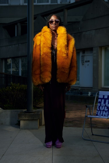 A model in an orange fur coat by Xuly.Bët