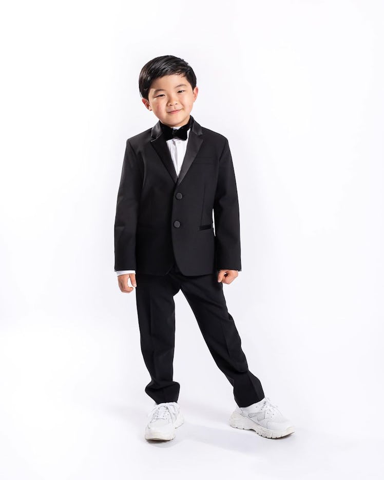 Alan Kim in an Emporio Armani formal suit
