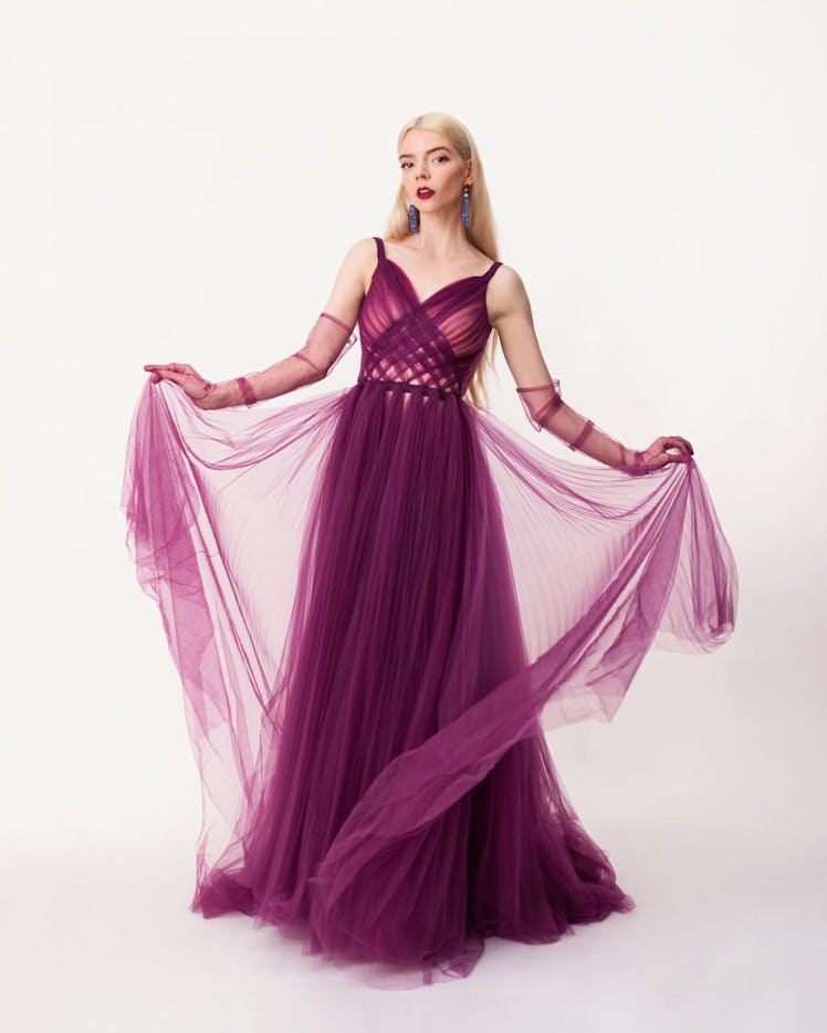 Anya Taylor-Joy posing in a purple Dior Haute Couture gown