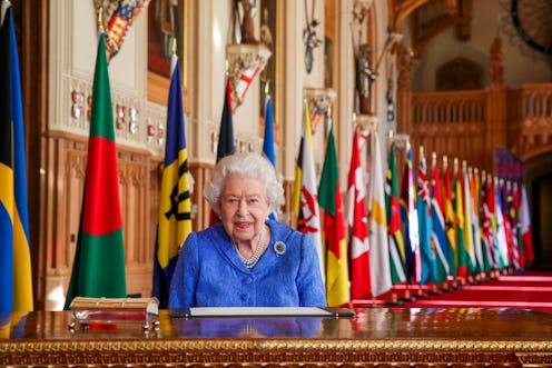 Queen Elizabeth II signs her annual Commonwealth Day Message in St George's Hall at Windsor Castle