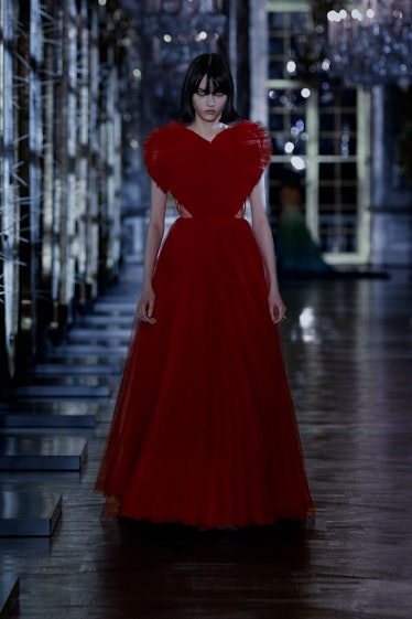 A model in a red gown with a heart-shaped top by Dior 