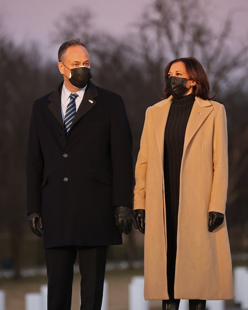 Vice President-elect Kamala Harris and her husband arrive for a ceremony to honor the victims of the...