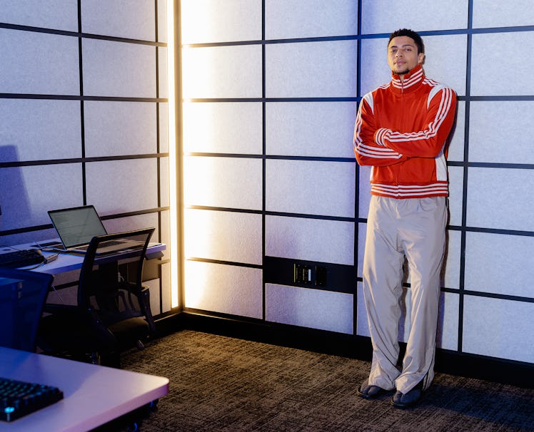 Ali “Myth” Kabbani in an Adidas Originals by Wales Bonner track top and grey Balenciaga pants
