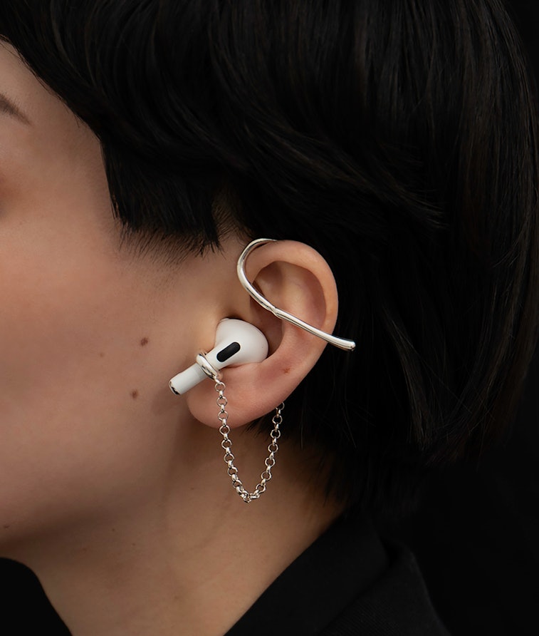 An ear cuff by Mara Paris which is able to hold your AirPods. It functions as both holding ring and ...