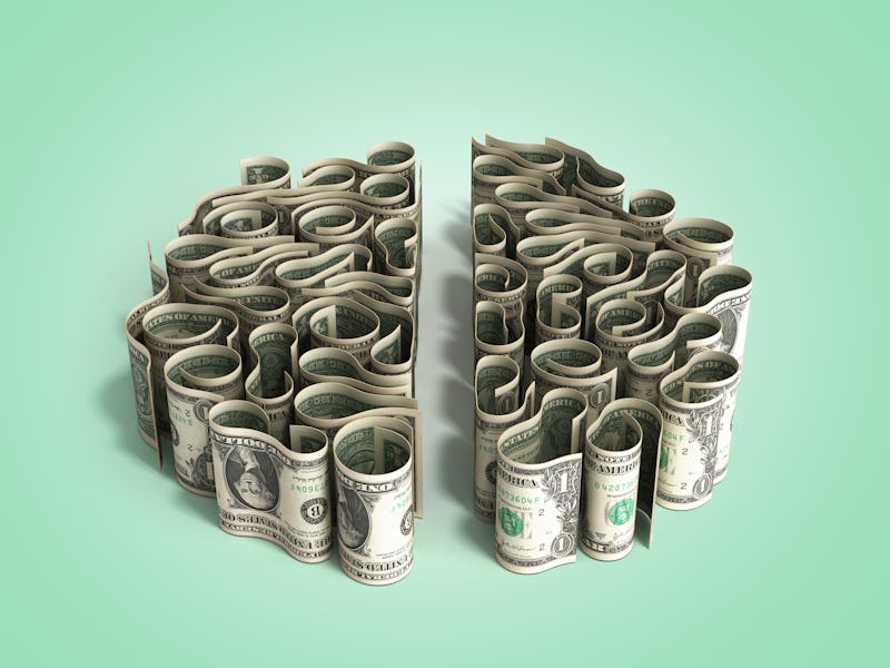 Brain-looking pile of paper money on green background