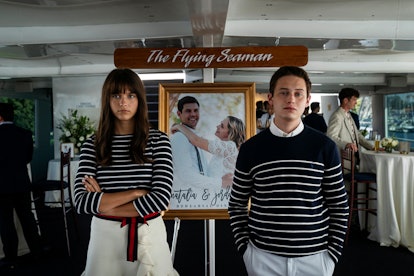 Chloe East and Uly Schlesinger in Generation, each wearing matching striped outfits and standing in ...