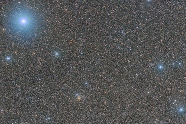 an image of a starfield with some bright, blue stars standing out