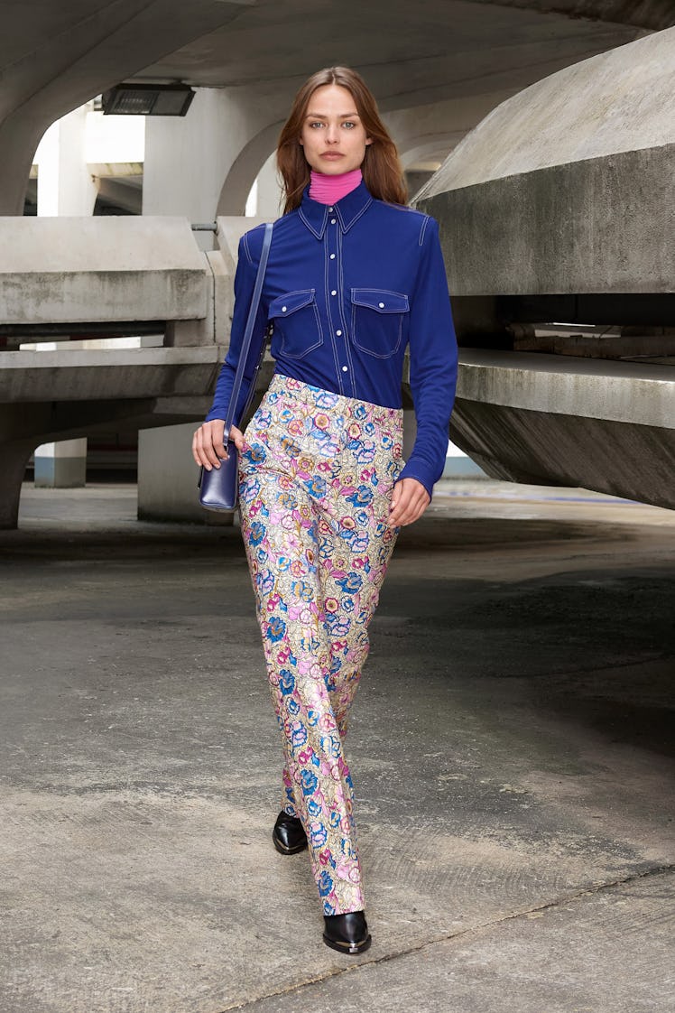 A model in a denim button-up and floral pants by Isabel Marant 