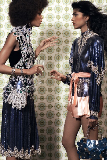 Two models in blue shimmery dresses by Paco Rabanne 