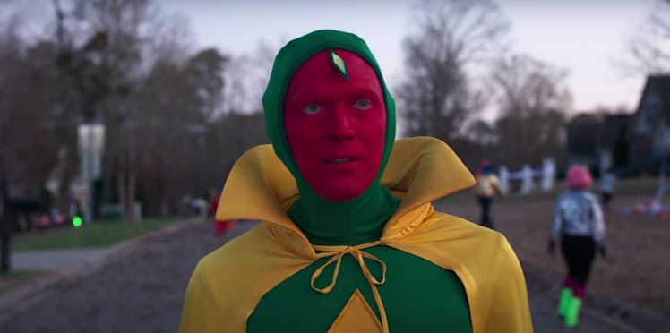 Vision walks through the neighborhood in his Halloween costume in 'WandaVision.'