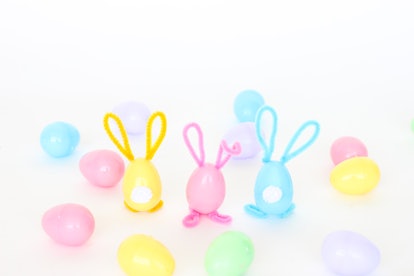 Plastic Easter eggs with pipe cleaner ears and feet and cotton ball tail