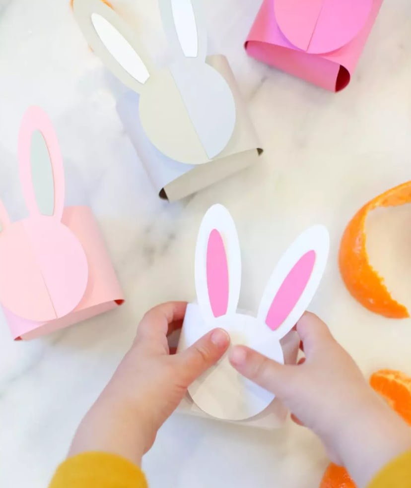 Kid hands holding a bunny paper craft