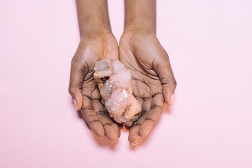 Woman holding a crystal