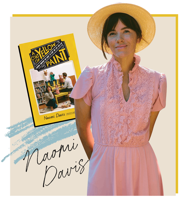 Naomi Davis standing to her new book A Coat Of Yellow Paint