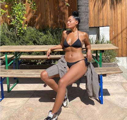 Tracee Ellis Ross wearing a black bikini.