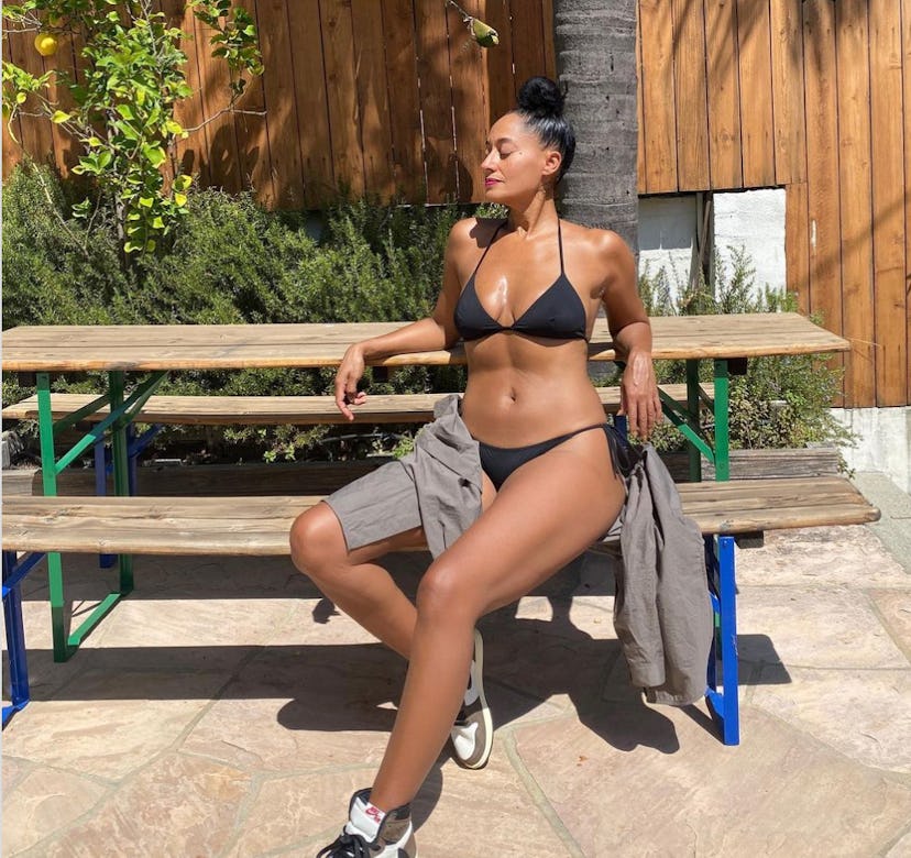 Tracee Ellis Ross wearing a black bikini.