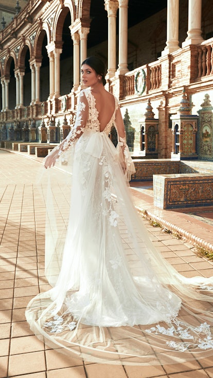 Model wearing a wedding dress from the Marchesa for Pronovias spring 2022 bridal collection.
