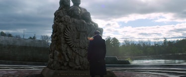 Daniel Brühl as Baron Zemo in front of Sokovia monument in The Falcon and the Winter Soldier