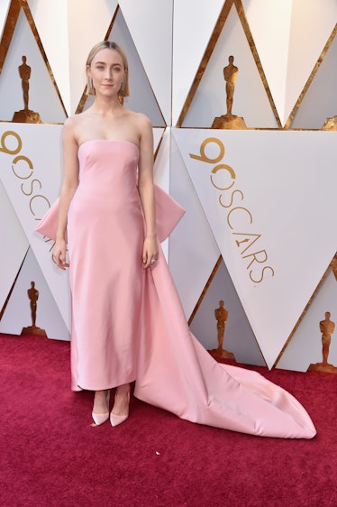 Saoirse Ronan wearing a pink gown at the 90th Annual Academy Awards red carpet