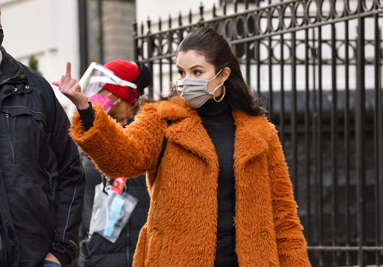 Selena Gomez giving the middle finger