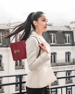 Model with Cartier's Double C de Cartier handbag.