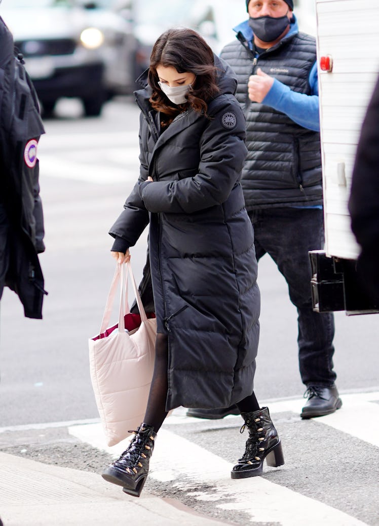 Selena Gomez wearing a long puffer coat