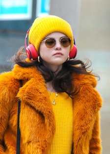 Selena Gomez wearing orange and yellow