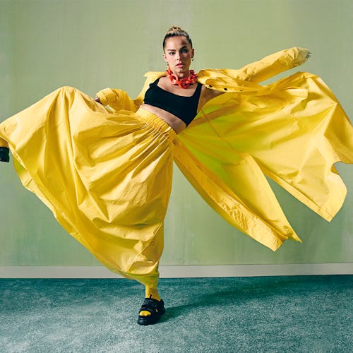 TikTok star Addison Rae wears a yellow outfit as she appears on Bustle's cover.