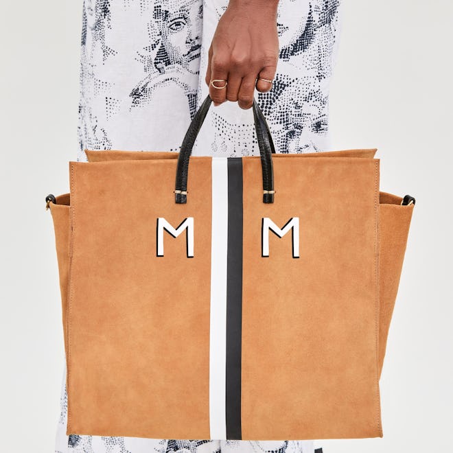 This camel-colored suede tote bag with black and white stripes is a splurge-worthy Mother's Day gift...