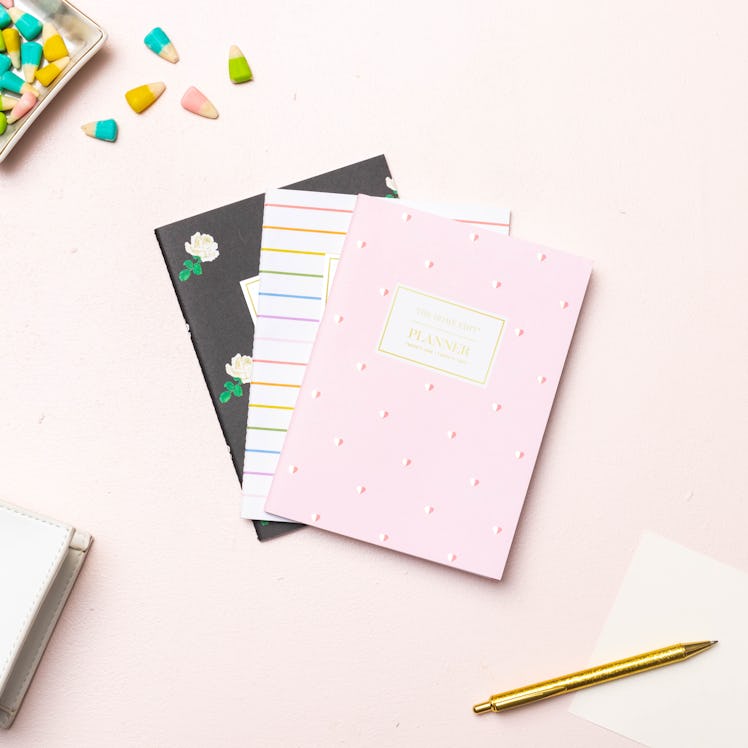 Three notebooks from The Home Edit for Day Designer collection lay on the table.