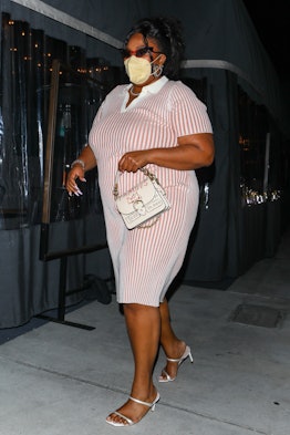 Singer, Lizzo looks stunning in a pink and white striped dress while leaving dinner at Crossroads Ki...