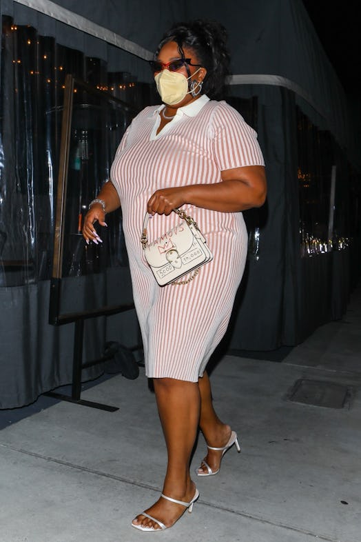 Singer, Lizzo looks stunning in a pink and white striped dress while leaving dinner at Crossroads Ki...