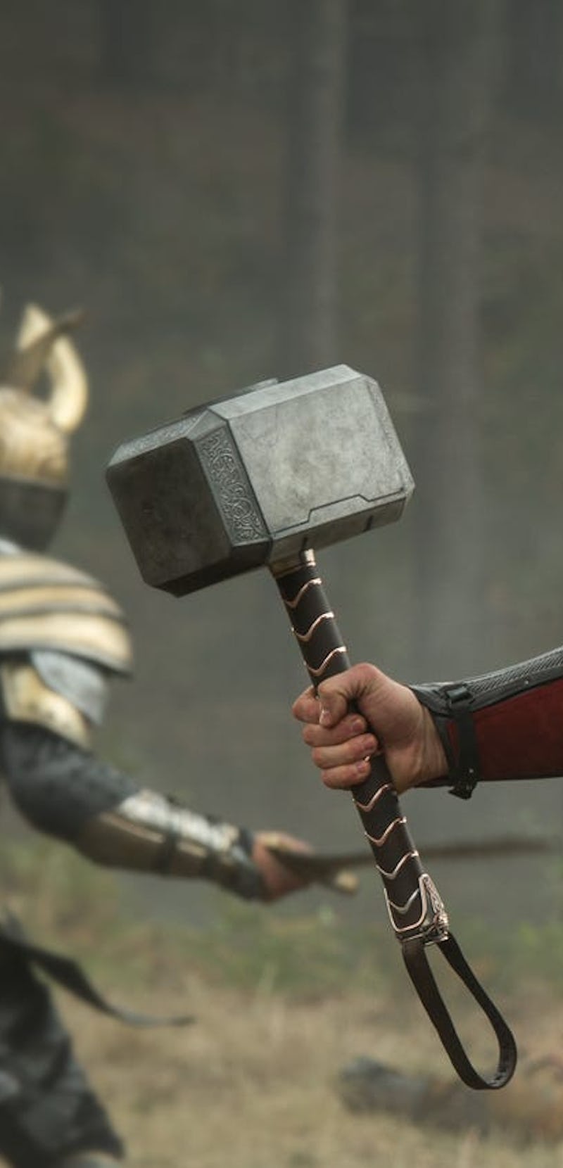 Chris Hemsworth as Thor holding his hammer Mjolnir