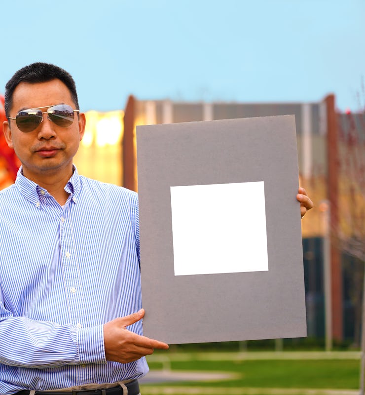 Xiulin Ruan, a Purdue University professor of mechanical engineering, holds up his lab's sample of t...