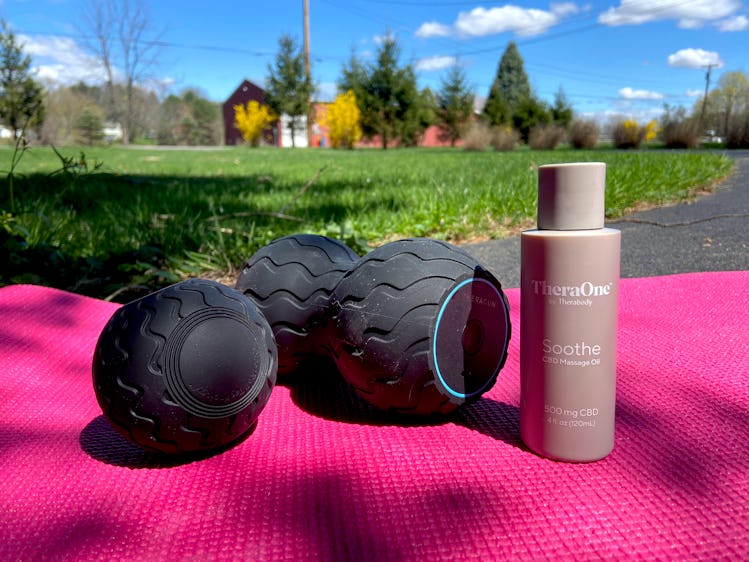 Wave Solo and Duo are shown atop a pink yoga mat in an outdoor setting. A bottle of CBD oil stands n...