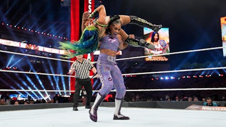 Bianca Belair lifts up Sasha Banks during a match at Wrestlemania 37 on Saturday, April 10, 2021.