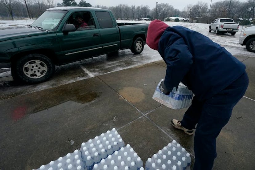 Jackson, Mississippi, residents pick up bottled water at a city distribution center on Feb. 18, 2021...