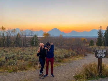 Gaby and Ben posing hugged during their walk in the Grand Tetons