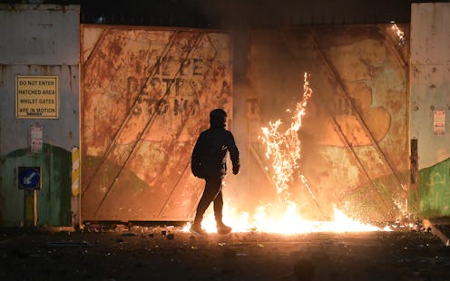 Nationalists and Loyalists riot against one another at the Peace Wall interface gates which divide t...
