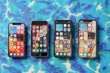 The iPhone 12 mini (left) next to the iPhone SE 2 (2020), iPhone 11 Pro, and iPhone 12.