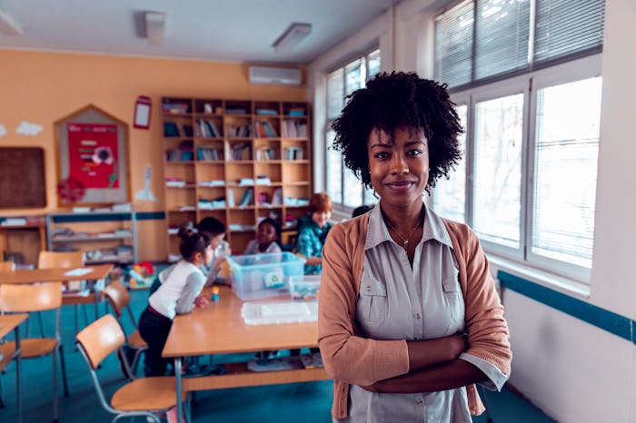 teacher standing in front of a classroom