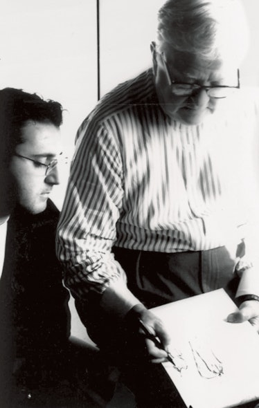 Alber Elbaz sitting next to Dawn Mello in a black-and-white photograph