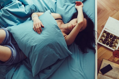 Woman trying to sleep despite menstrual cramps. Why are menstrual cramps worse at night?