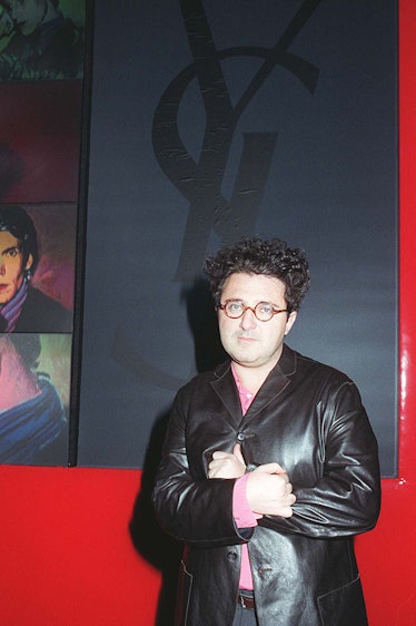 Alber Elbaz in a black leather jacket and a pink shirt at a YSL event