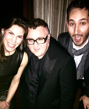 Alber Elbaz smiling and posing next to Kevin and Nicole Systrom