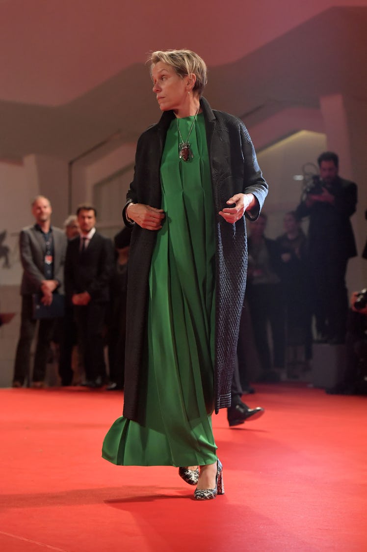 Frances McDormand wearing a green dress on the carpet