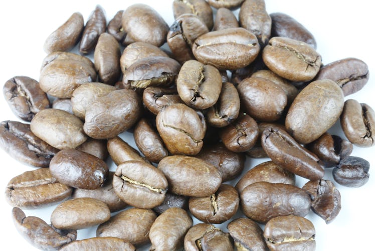 Arabica coffee beans on a white background